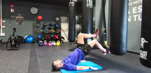 Puente de gluteo unilateral TRX